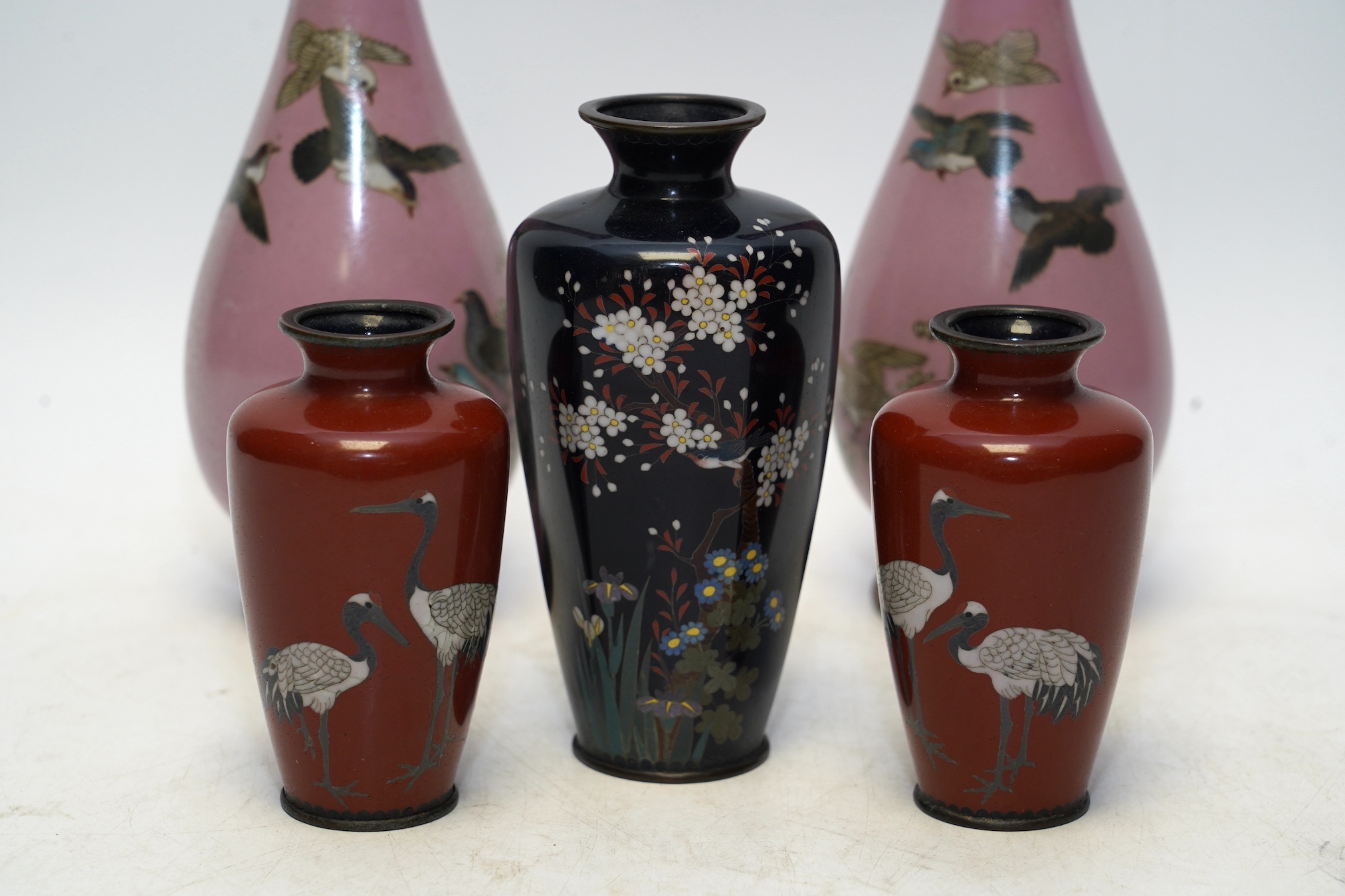 Two pairs and another Japanese cloisonné vases, Meiji period, tallest 25cm. Condition - two vases restored